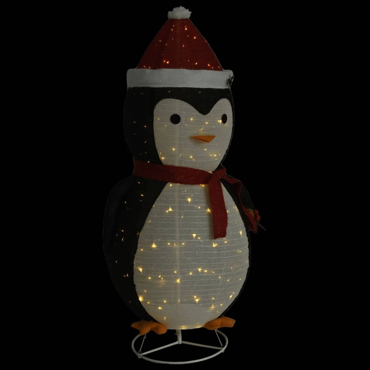 Beleuchtete Pinguin-Dekoration mit rotem Hut und Schal, auf schwarzem Hintergrund.