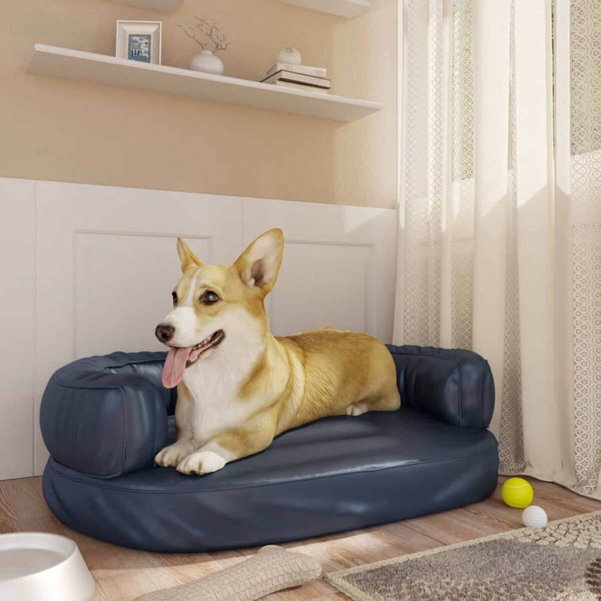 Corgi-Hund liegt auf einem blauen Hundebett in einem Raum, im Hintergrund eine weiße Wand.