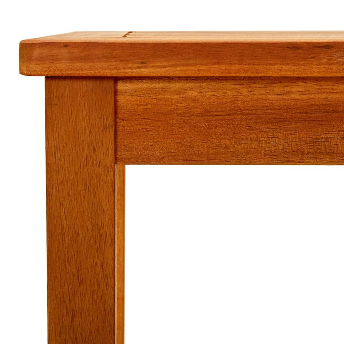 Nahaufnahme einer Holztischecke. Das Holz ist braun und hat eine Maserung.