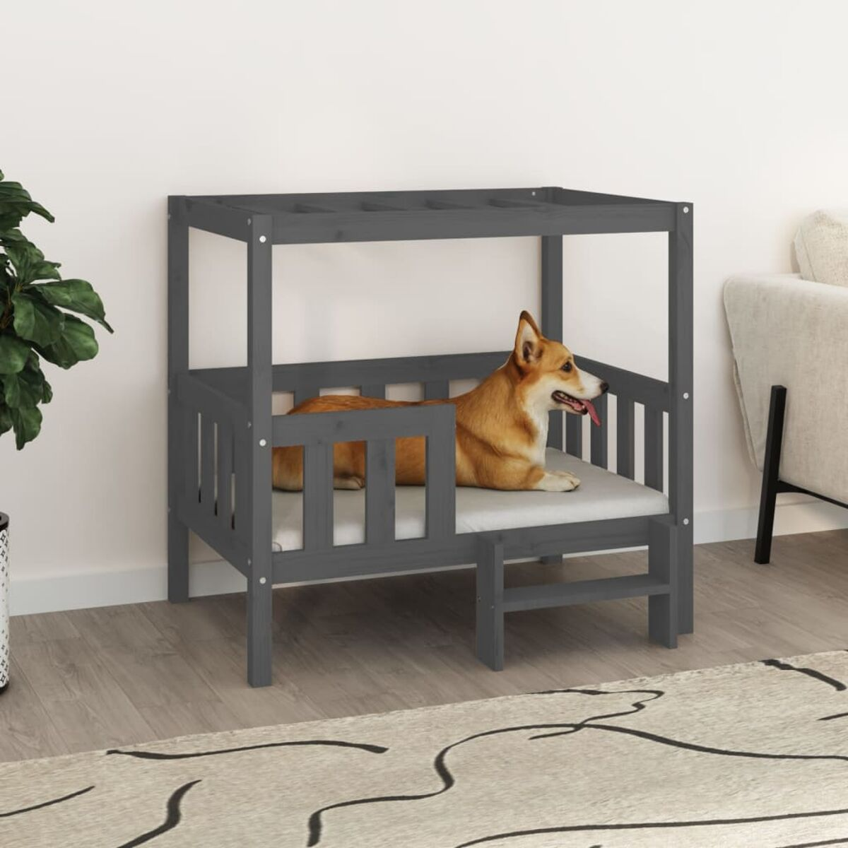 Ein Hundebett mit einem braunen Hund, der auf dem grauen Kissen liegt.