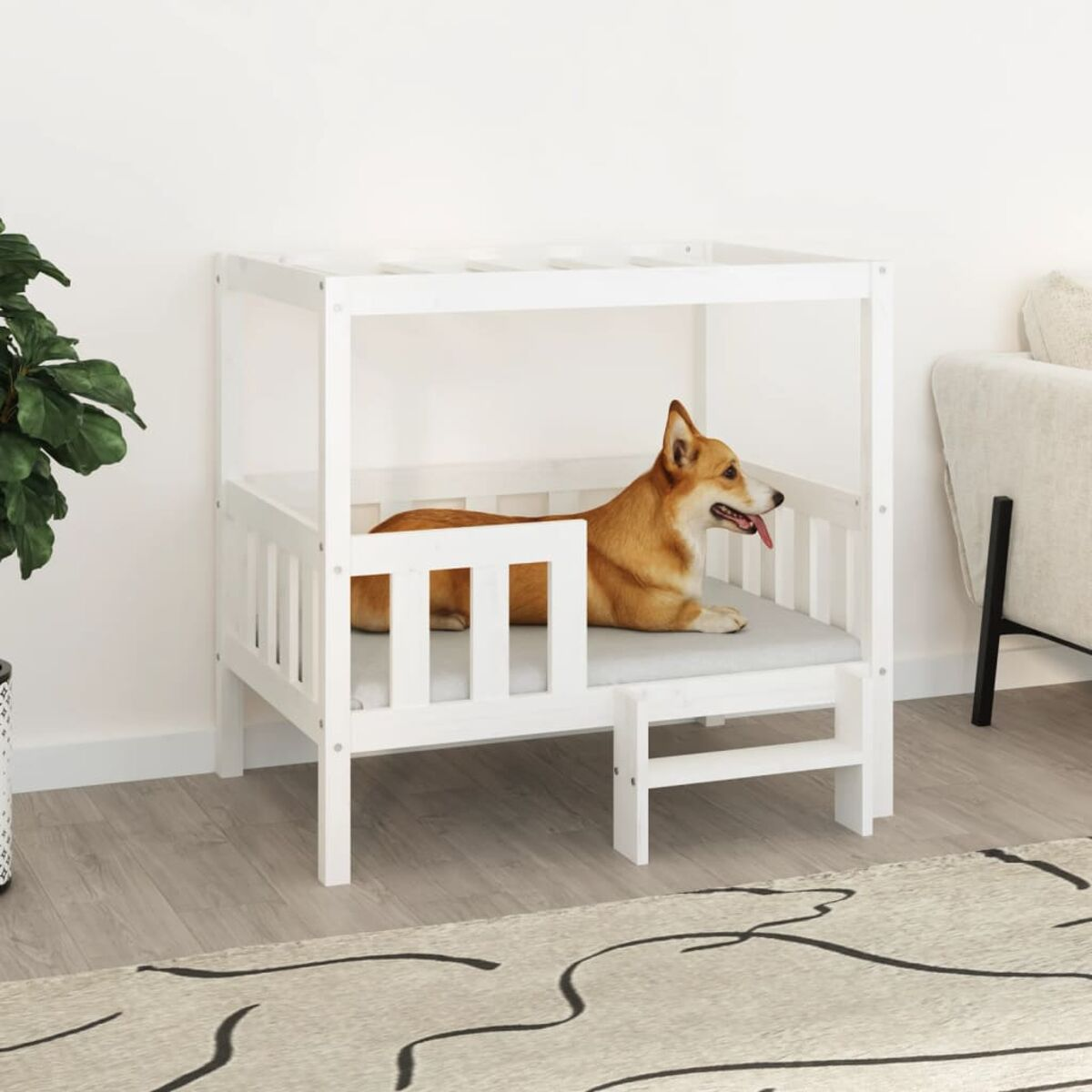 Ein Hund in einem weißen Holzbett mit einer Stufe.
