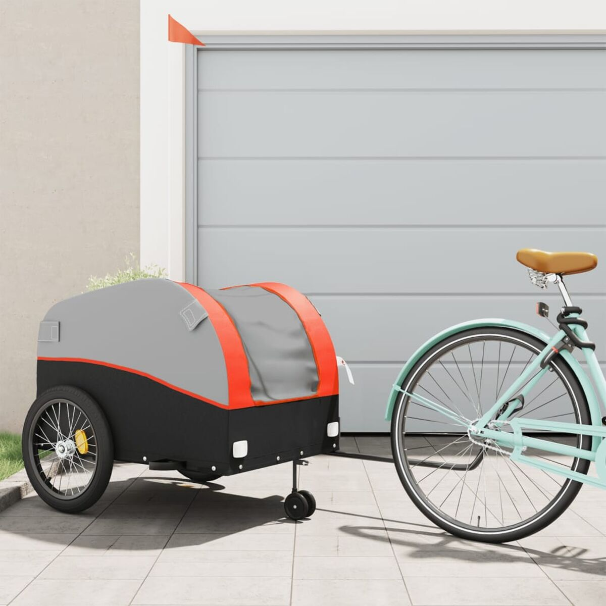 Fahrrad mit grauem Anhänger. Die Szene ist in einer Garage.
