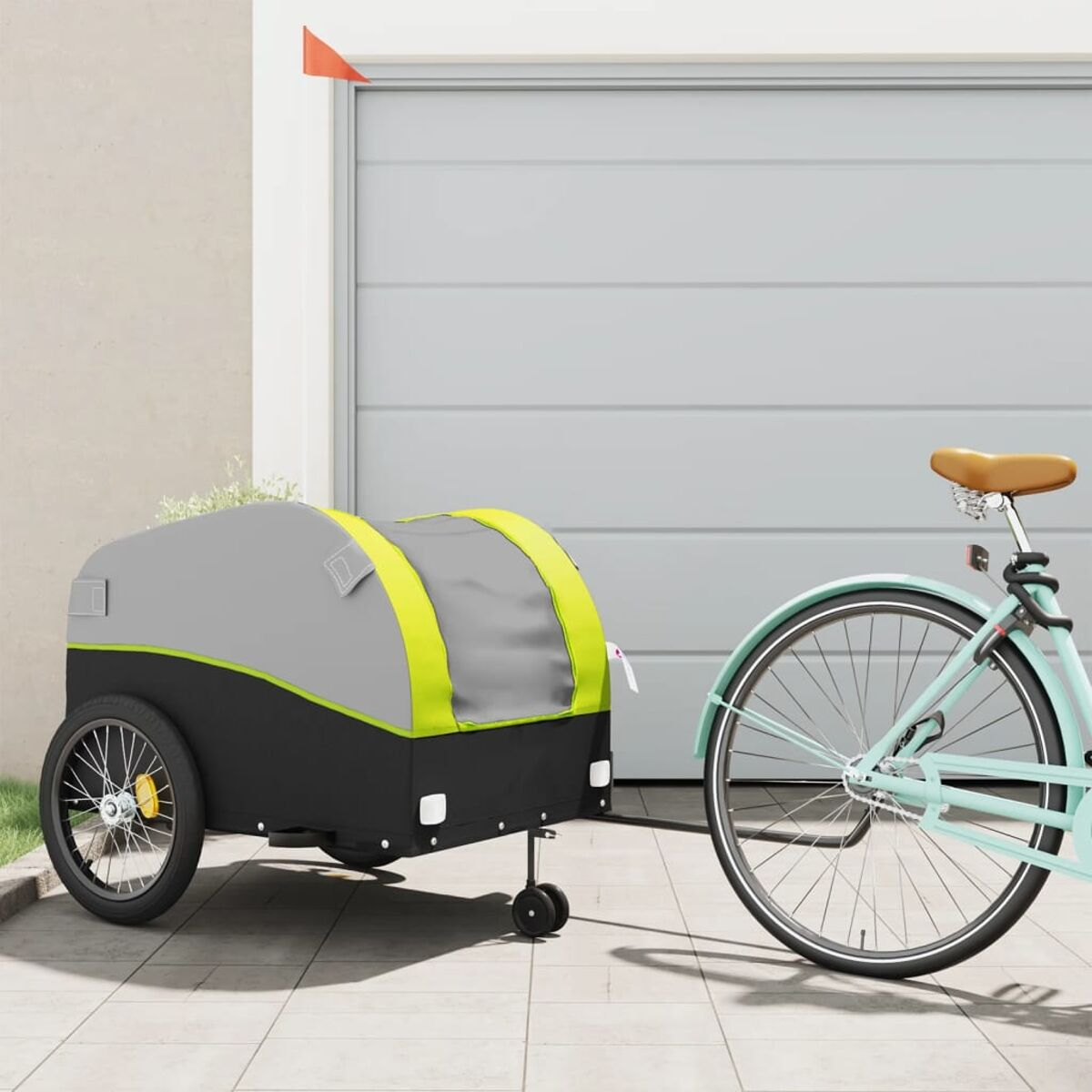 Blaues Fahrrad mit Anhänger und roter Fahne.