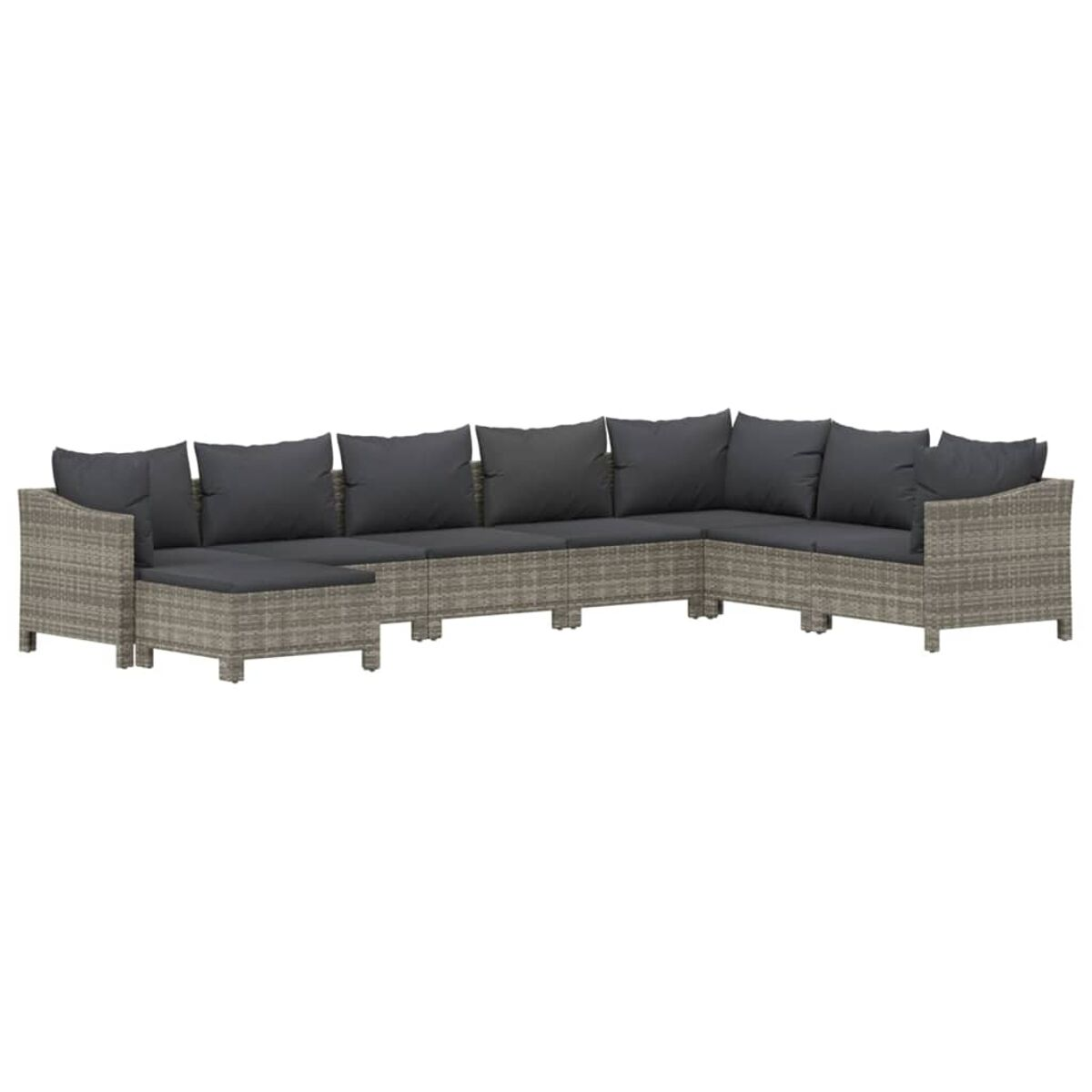 Ein graues Rattan-Ecksofa mit grauen Kissen, vor weißem Hintergrund.