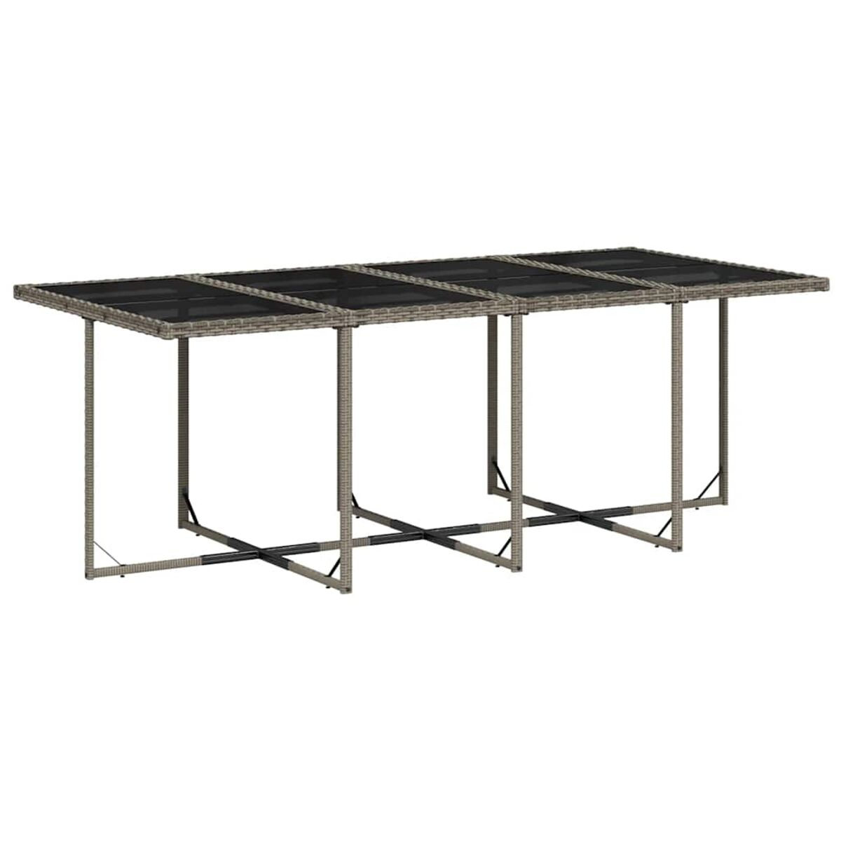 Tavolo rettangolare da esterno con piano in vetro. Il tavolo è sostenuto da gambe in vimini e traverse.