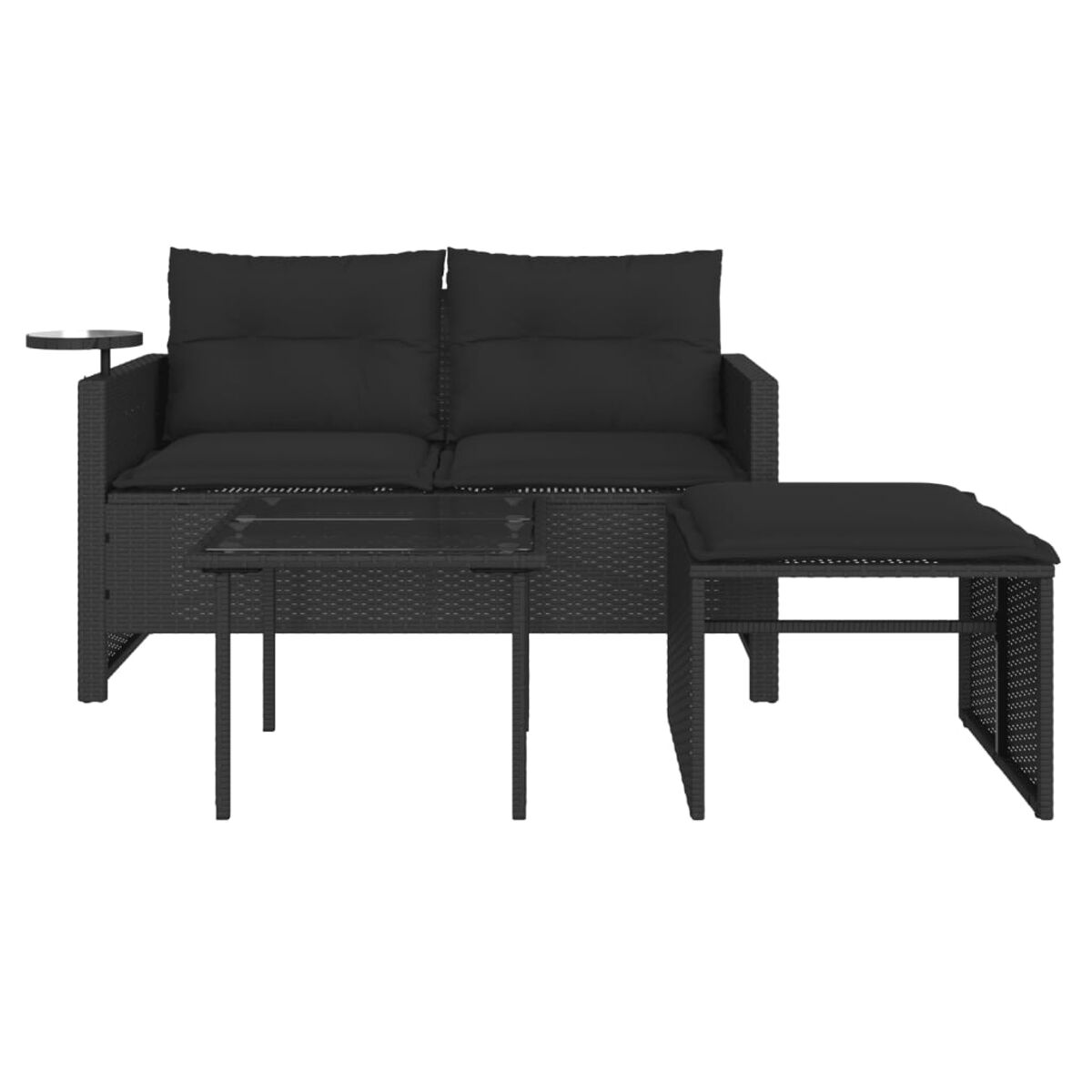 Set divano in rattan nero con tavolo in vetro e sgabello, su sfondo bianco.