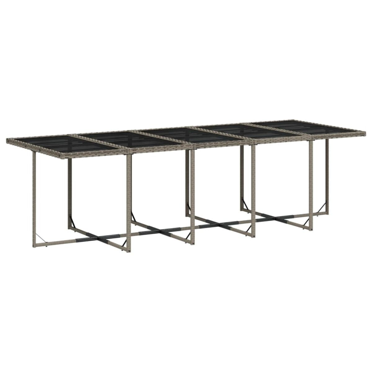 Tavolo lungo da esterno con piano in vetro e struttura intrecciata.