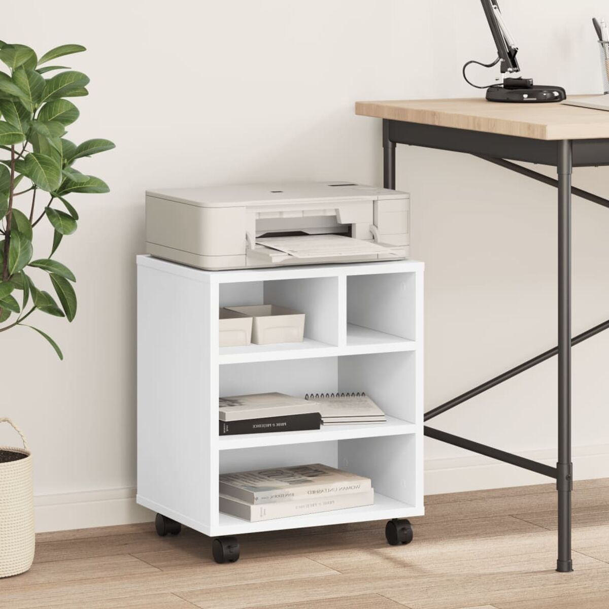 Weißer Rollcontainer mit Drucker, Büchern und Zubehör auf einem Hartholzboden.