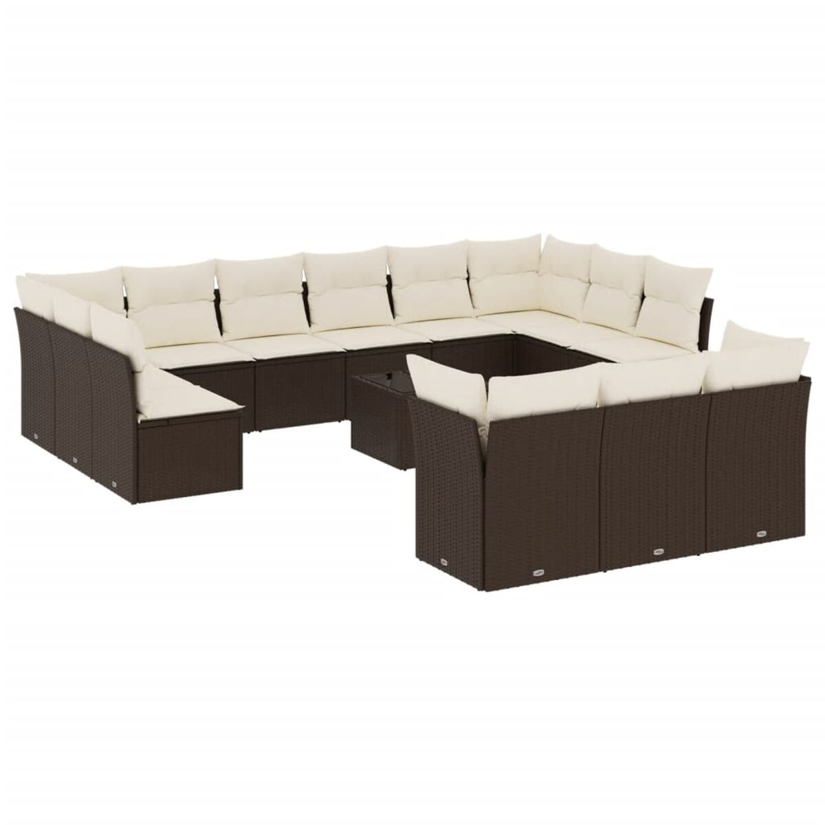 Divano componibile in vimini marrone scuro con cuscini color crema e tavolino.