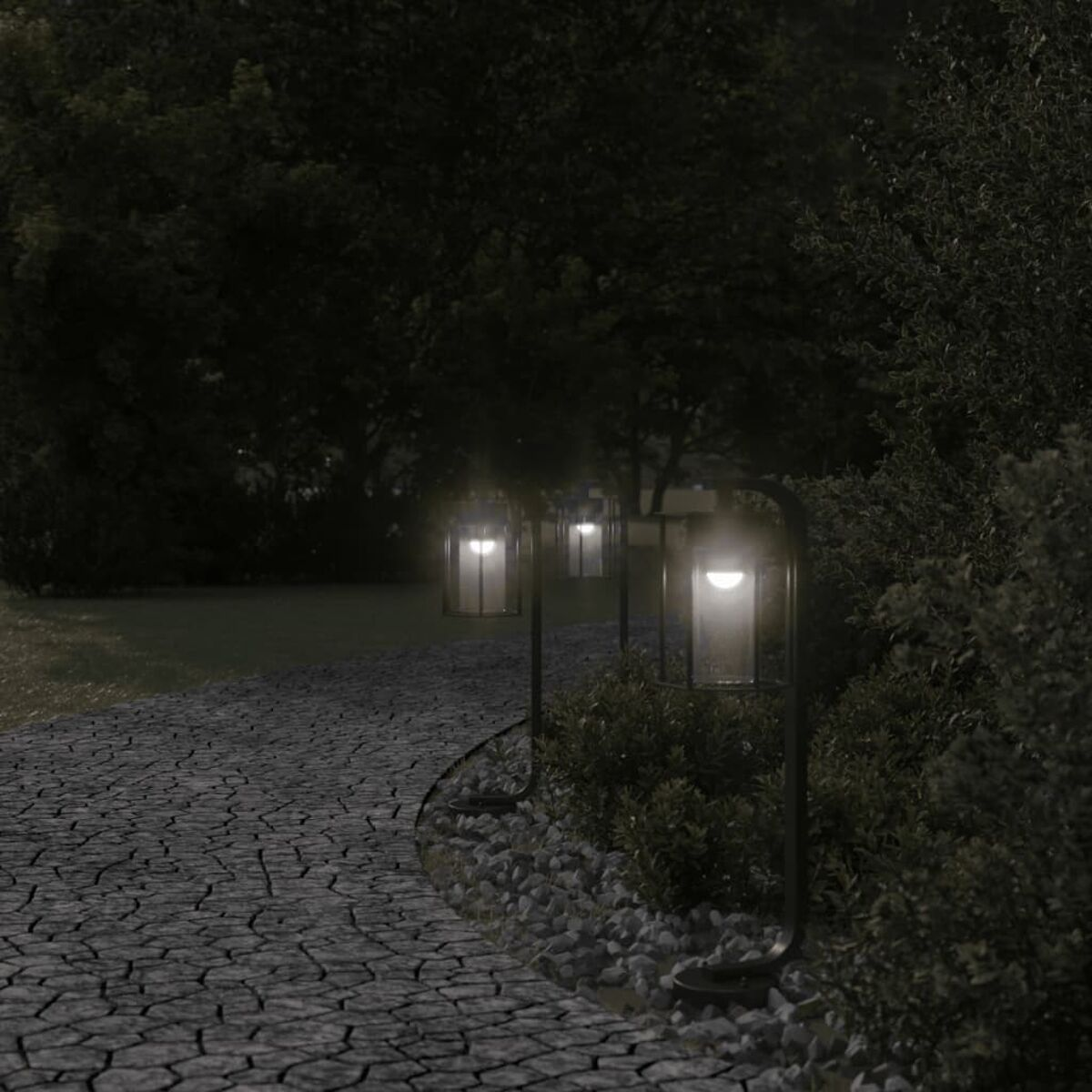 Sentiero con pavimentazione in pietra e una fila di lampade da esterno. Alberi e cespugli sullo sfondo.