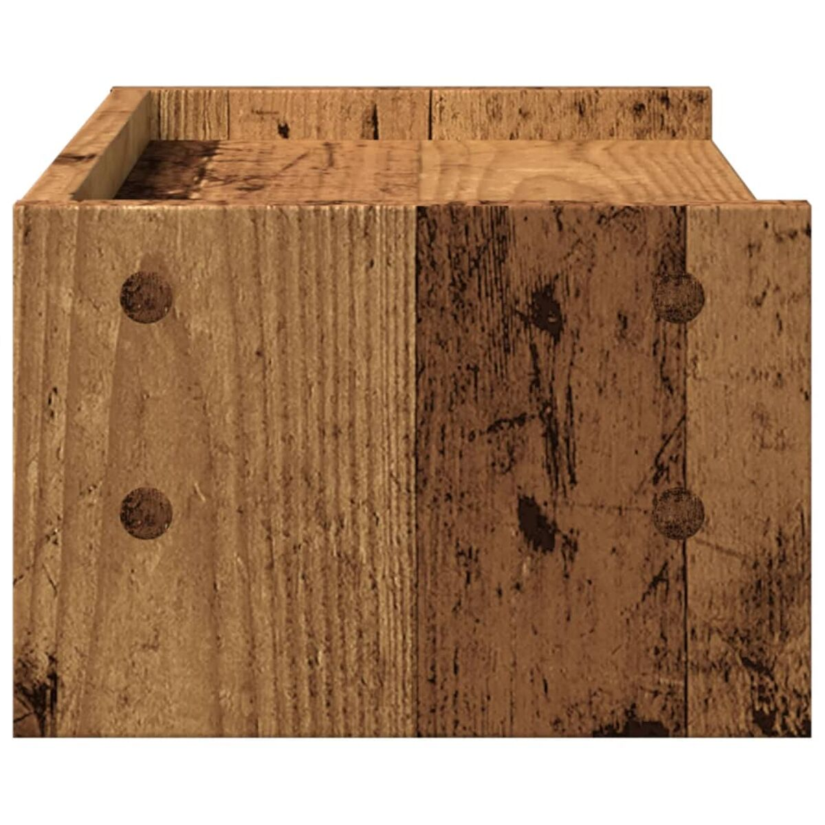 Nahaufnahme eines Holzblocks mit unebener Oberfläche und dunklen Holzschraubenköpfen.