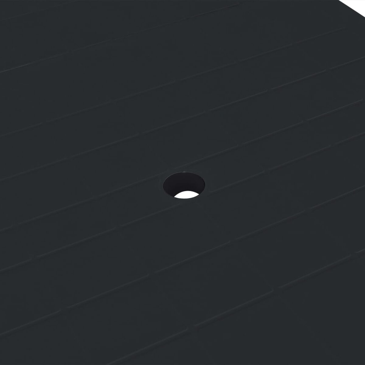 Schwarze Tischplatte mit einem Loch. Weißer Hintergrund.