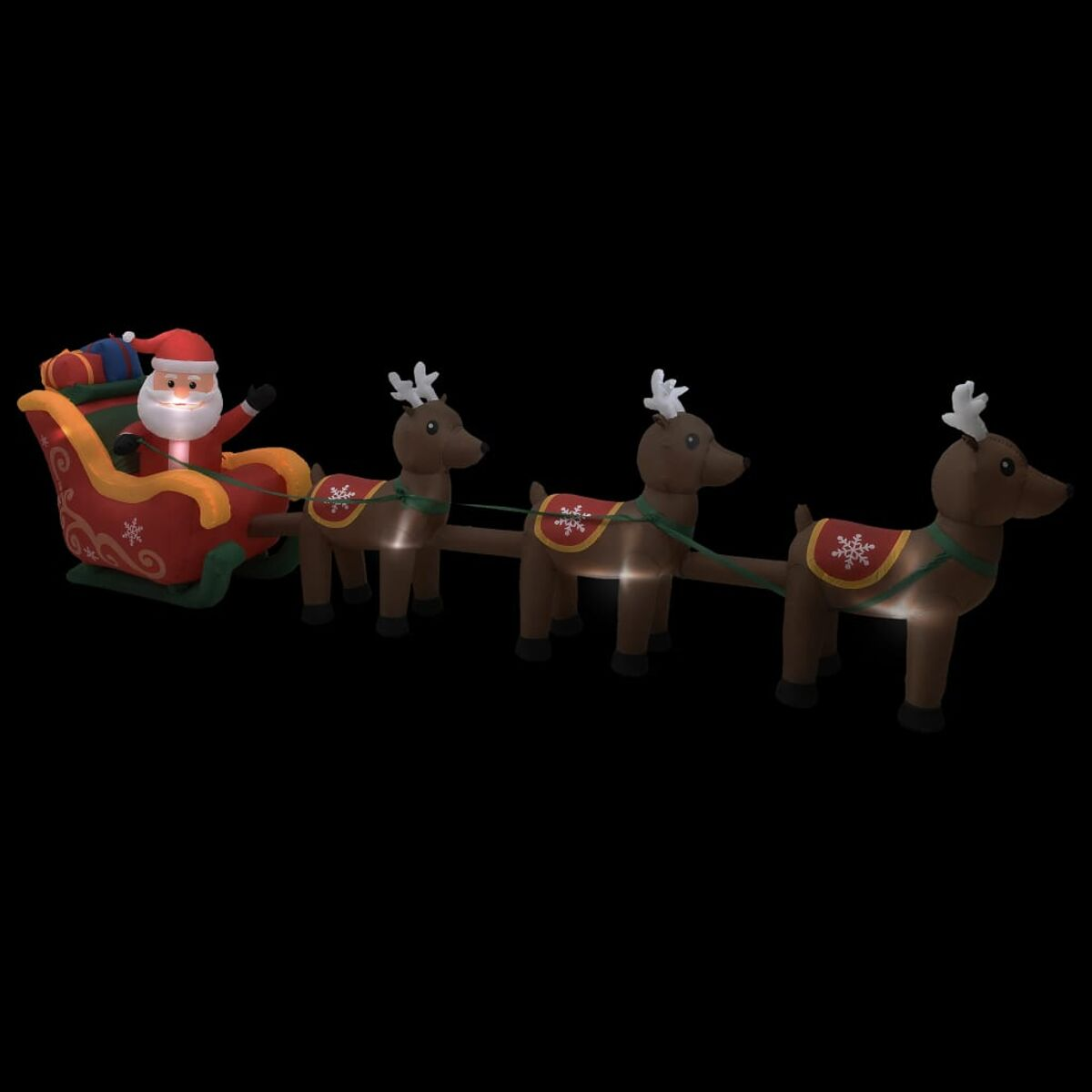 Beleuchtete Weihnachtsszene mit Weihnachtsmann im Schlitten, von Rentieren gezogen.