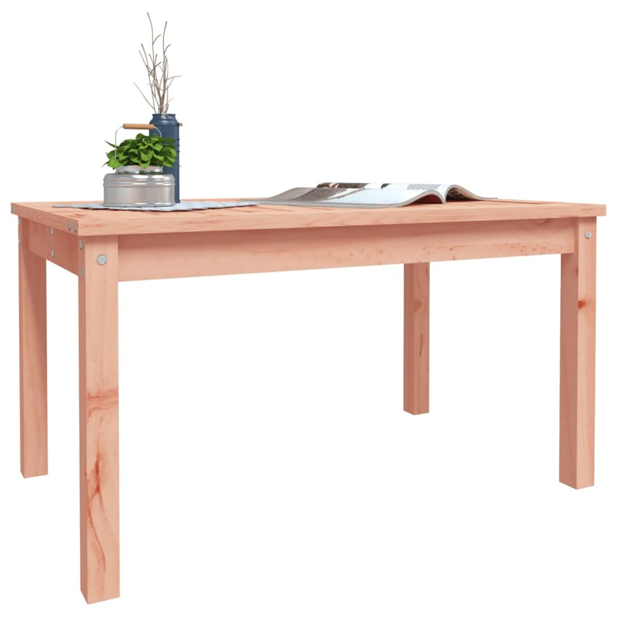 Holztisch mit Vase, Pflanzen und einem Buch. Der Tisch hat eine helle Holzfarbe.