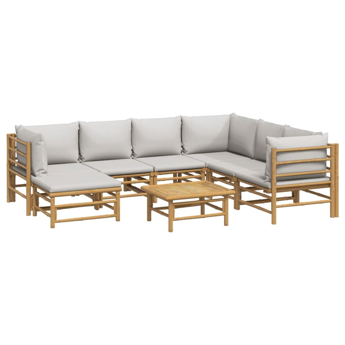 Bambus-Ecksofa mit passendem Couchtisch und weißen Kissen.