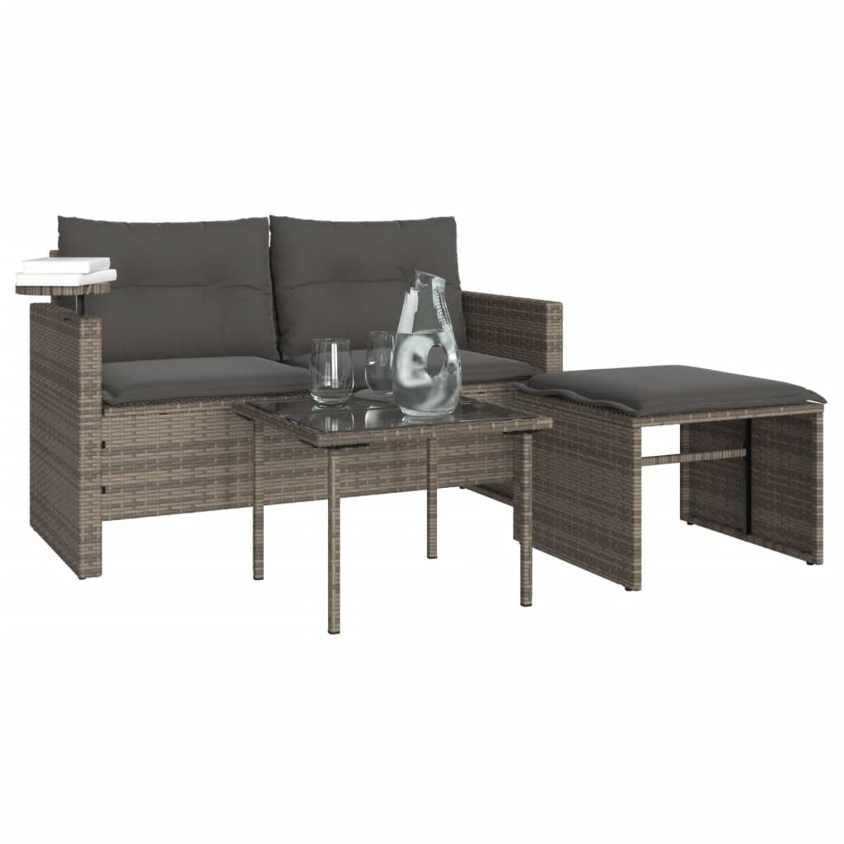 Un set da giardino con divano, tavolo con piano in vetro e sgabello, tutto grigio-marrone.