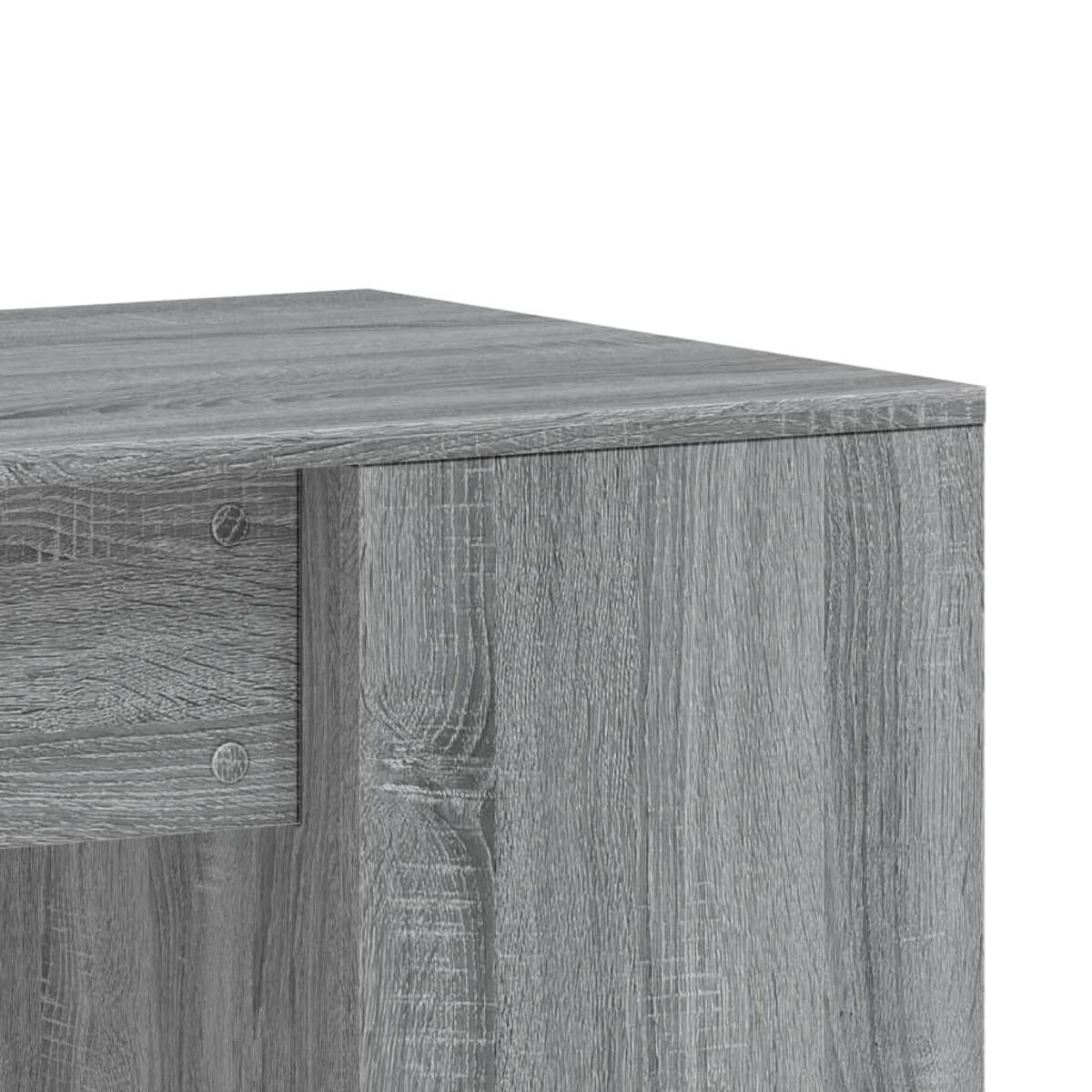 Nahaufnahme einer grauen Holzecke. Die Holzmaserung ist sichtbar.