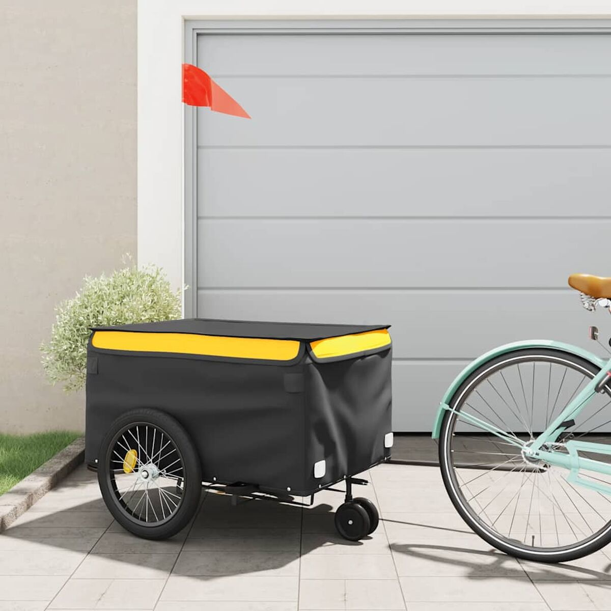 Ein Fahrrad mit Anhänger. Der Anhänger ist schwarz und gelb. Der Hintergrund ist weiß.