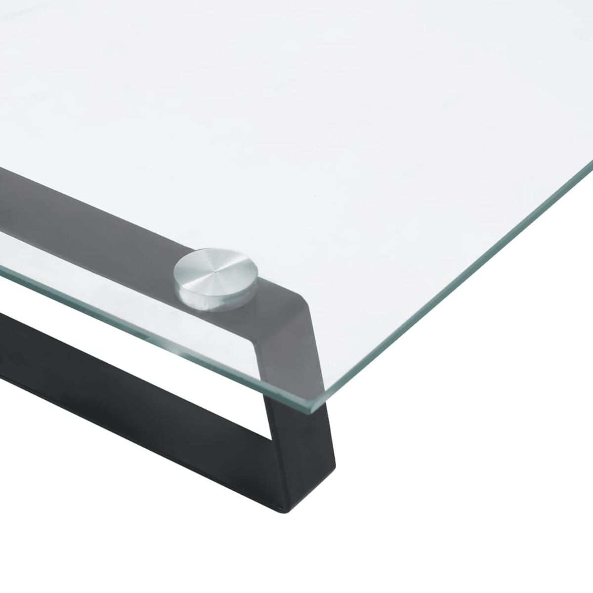 Nahaufnahme einer Glasplatte mit schwarzem Metallrahmen und rundem Metallakzent.