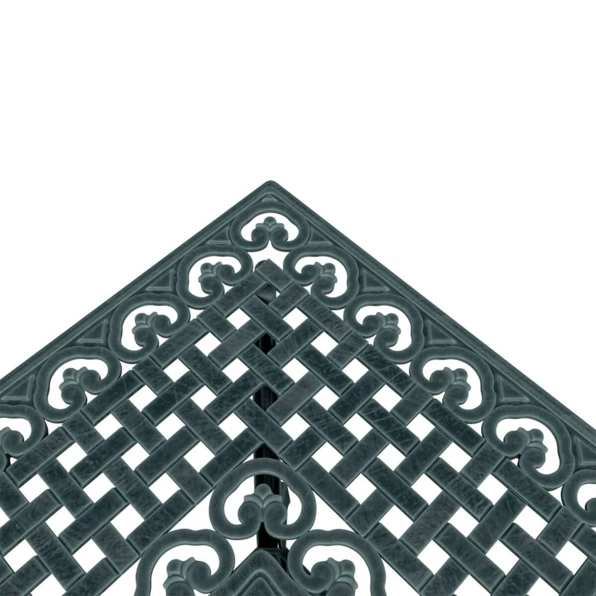 Eine Ecke eines dunkelgrünen Metalltisches. Es hat ein gewebtes Muster und dekorative Kanten.