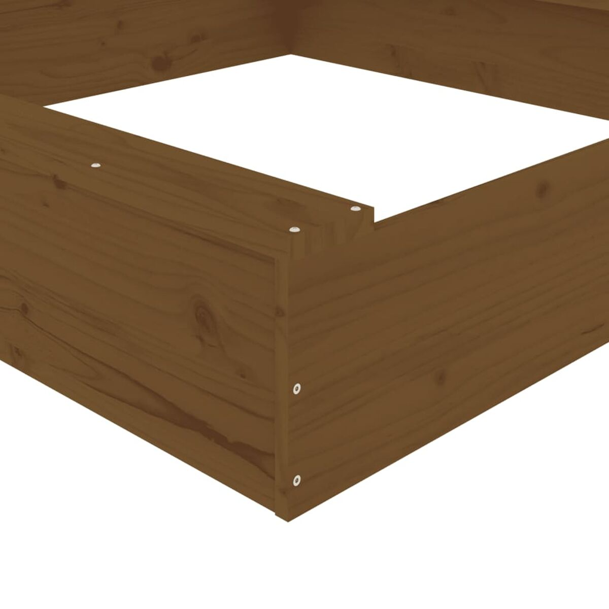 Primo piano di un angolo in legno con fori per viti.