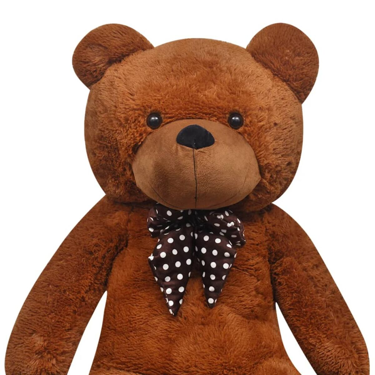 Ein großer brauner Teddybär mit einer gepunkteten Schleife. Der Bär hat eine schwarze Nase und Augen.
