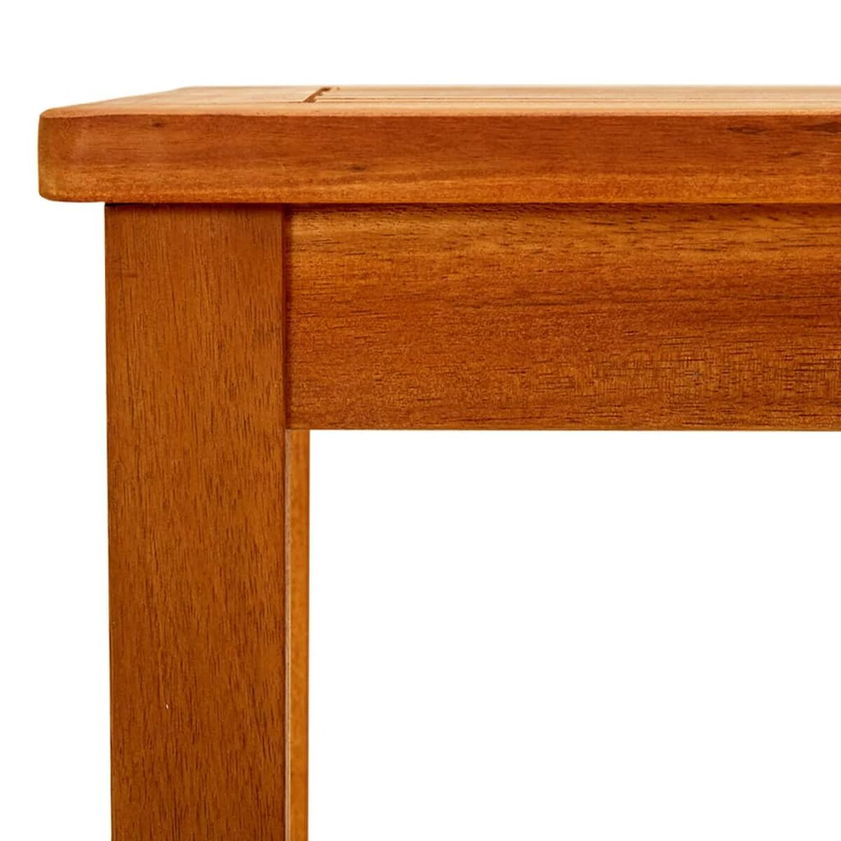 Nahaufnahme einer Holztischecke. Das Holz ist braun und hat eine sichtbare Maserung.