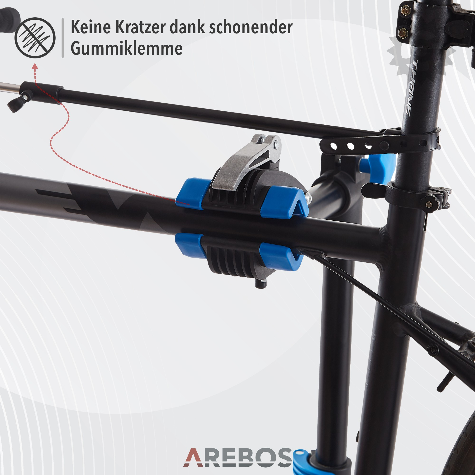 Fahrradrahmenklemme mit blauen Gummigriffen, mit deutschem Text.