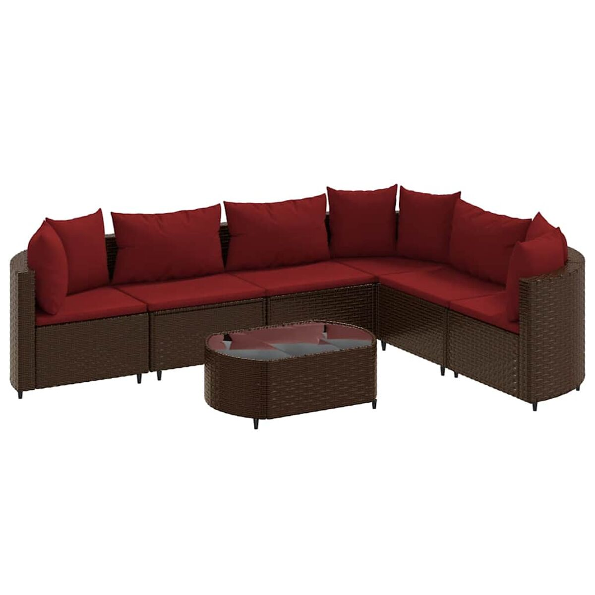 Un set di divani in rattan marrone con cuscini rossi e un tavolino coordinato con piano in vetro.