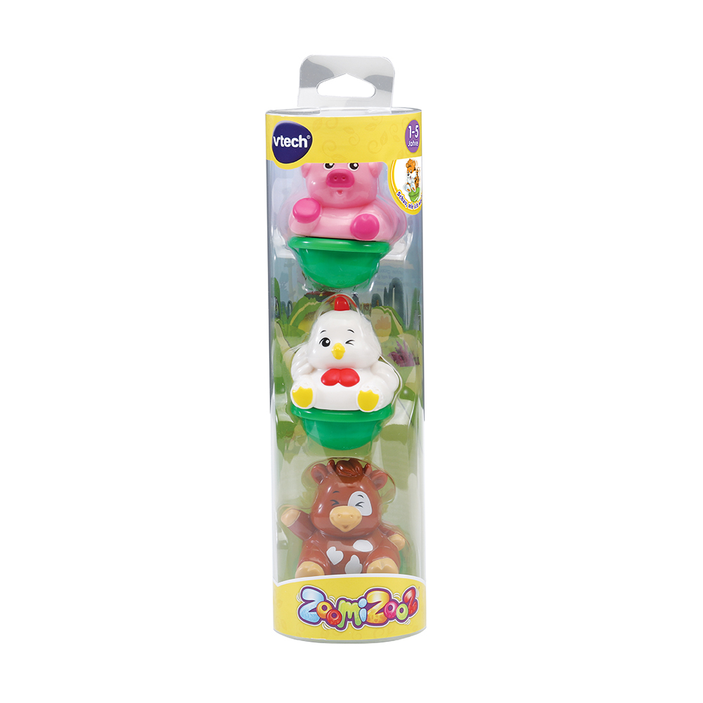 Spielzeugset in Kunststoffverpackung: Schwein, Huhn, Kuh, grün und rosa.