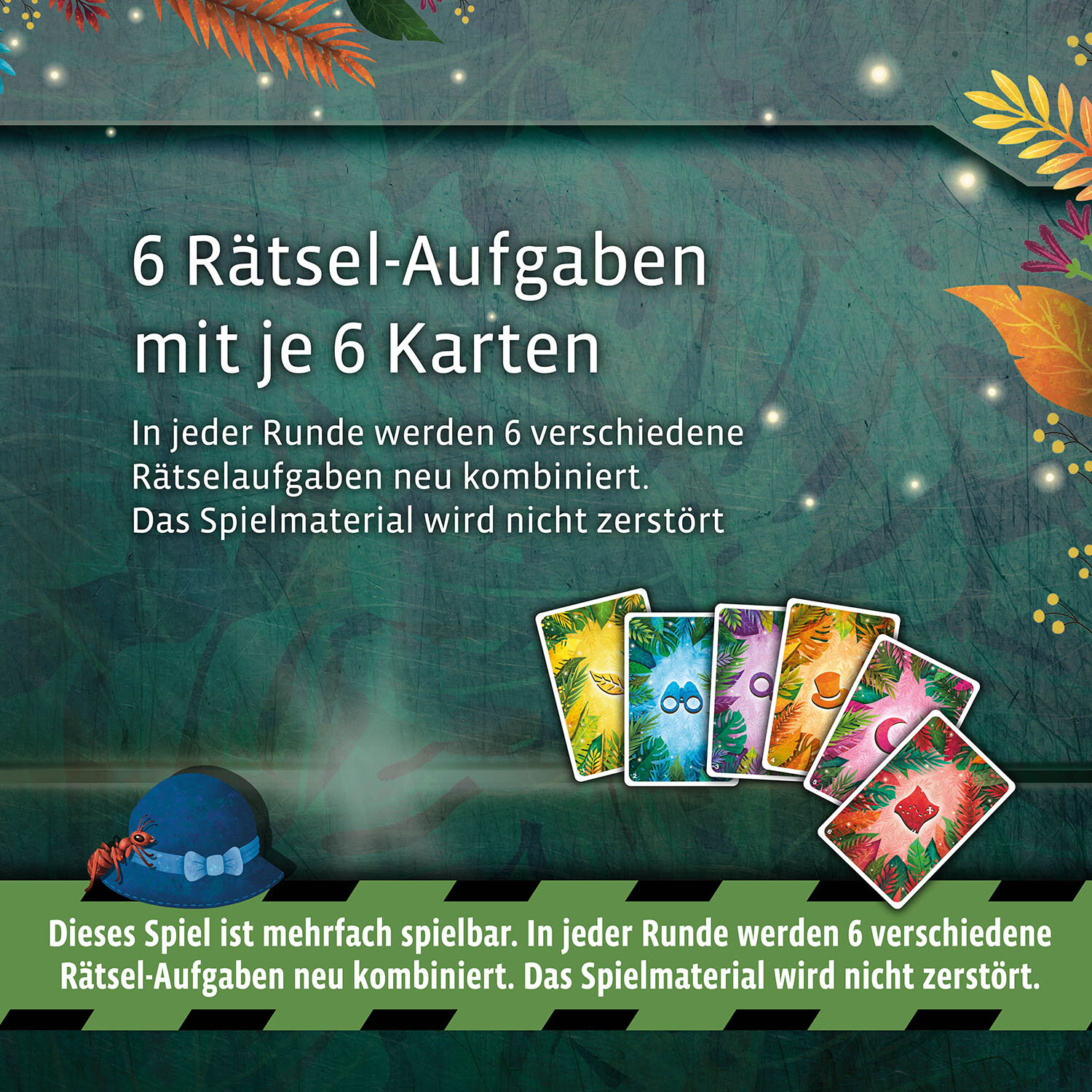 Una scatola di gioco con carte colorate e testo in tedesco. Carte su una superficie verde.