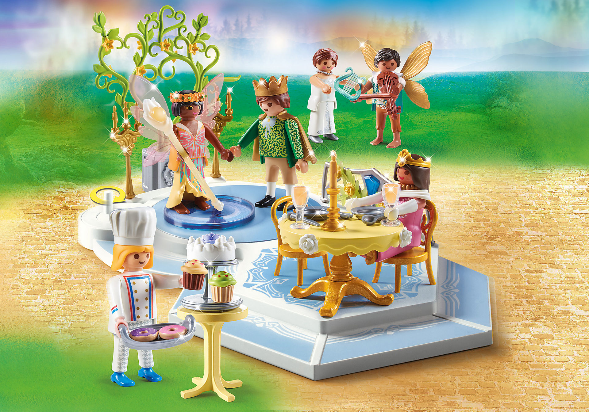Eine Playmobil-Szene mit Figuren von Königen, einem Koch und Feen. Ein Tisch ist für ein Fest gedeckt.