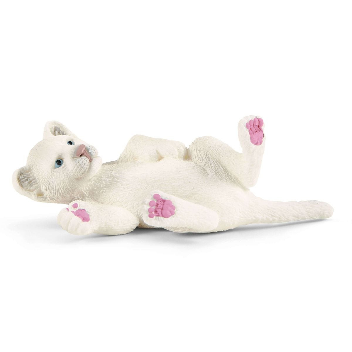 Biały zabawkowy kotek leży na plecach z różowymi łapkami.