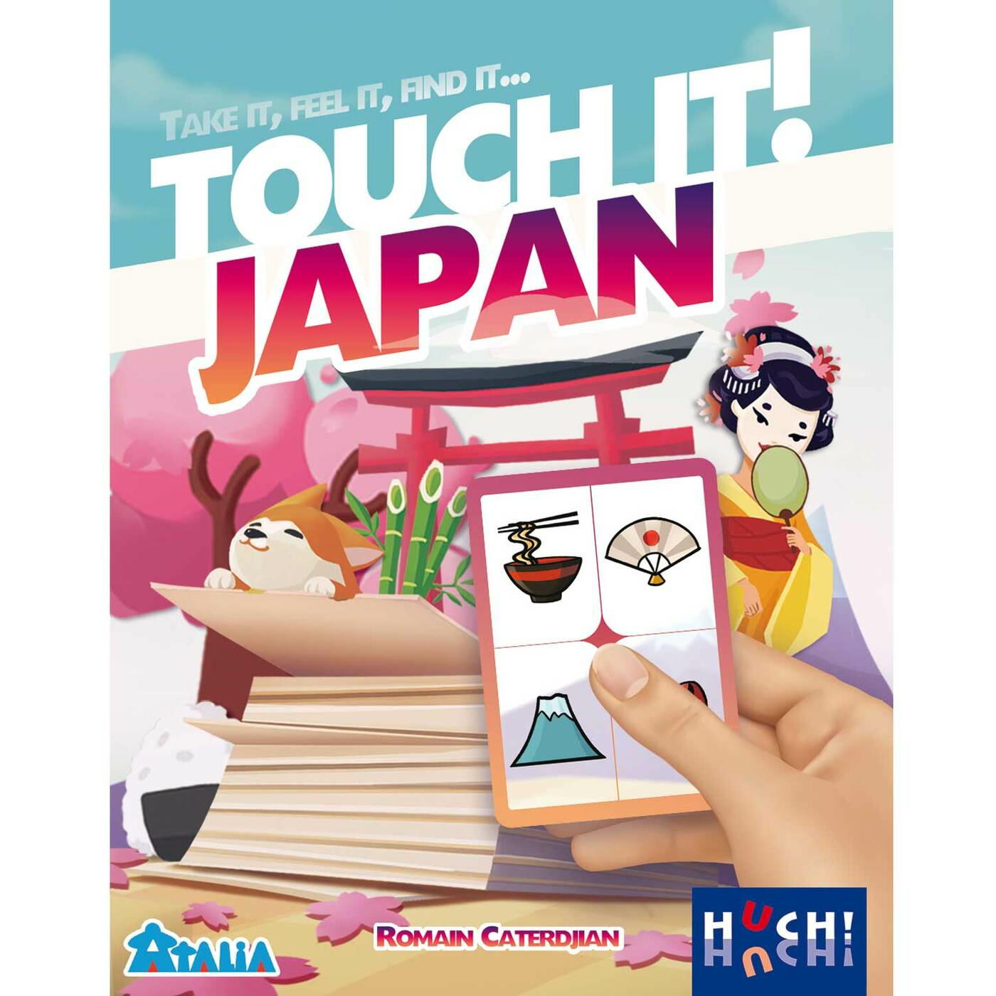 Eine Spielbox, die eine Hand zeigt, die eine Karte mit japanischen Symbolen hält.