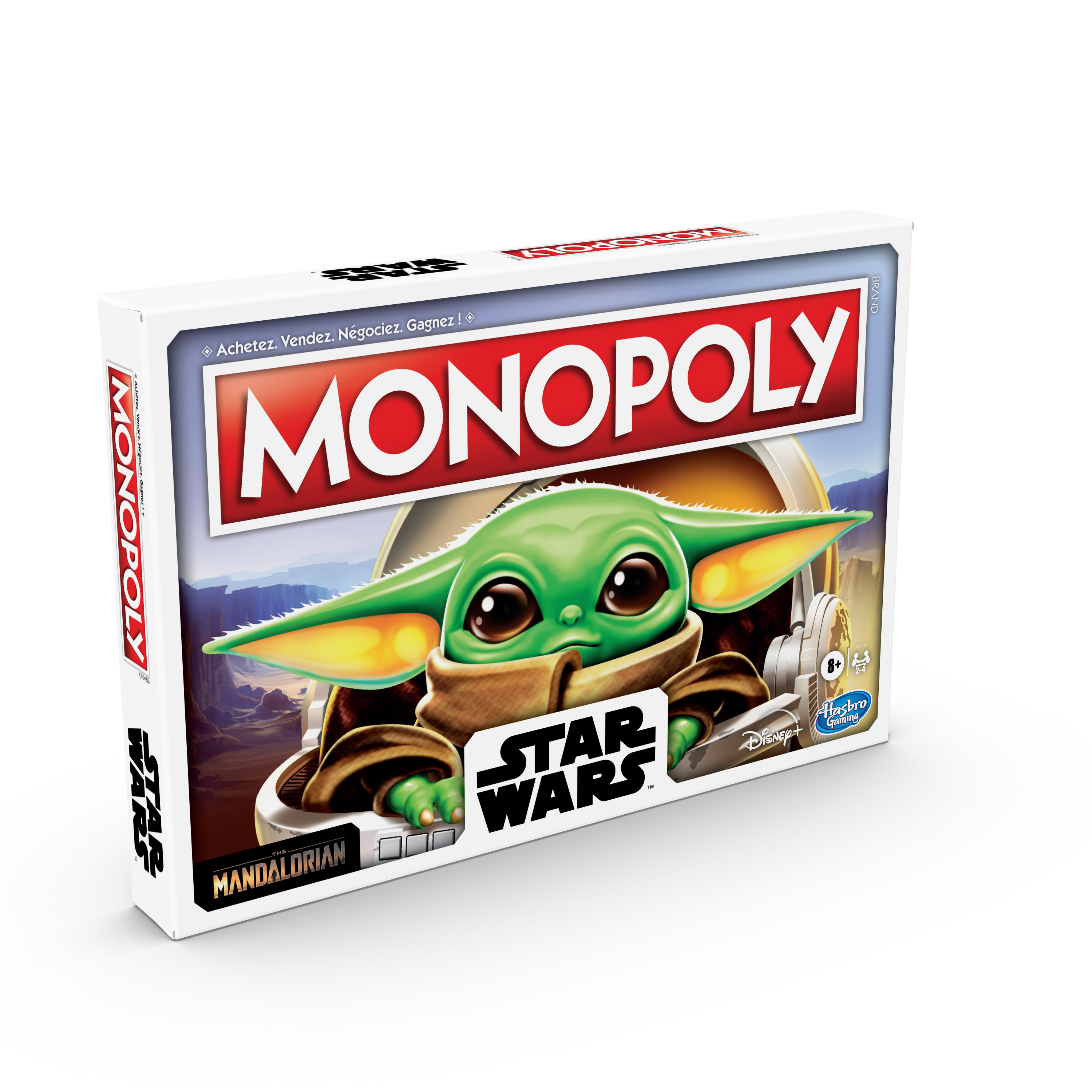 Pudełko gry planszowej Monopoly Star Wars z Baby Yodą, z Mandalorianem z boku.