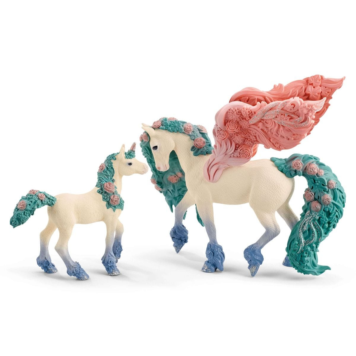 Zwei Einhornfiguren, ein Erwachsener und ein Fohlen, mit Blumendetails und Flügeln.