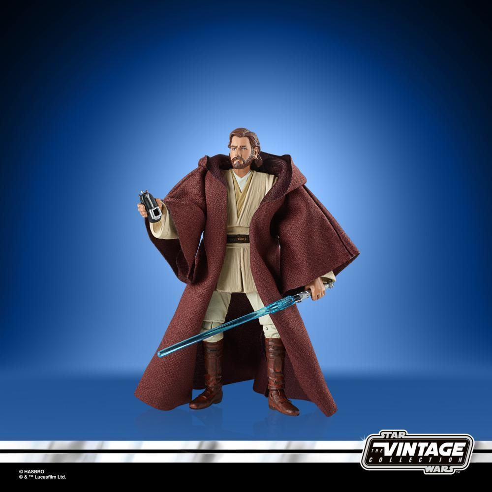 Figura di Obi-Wan Kenobi in abiti marroni con spada laser e dispositivo.
