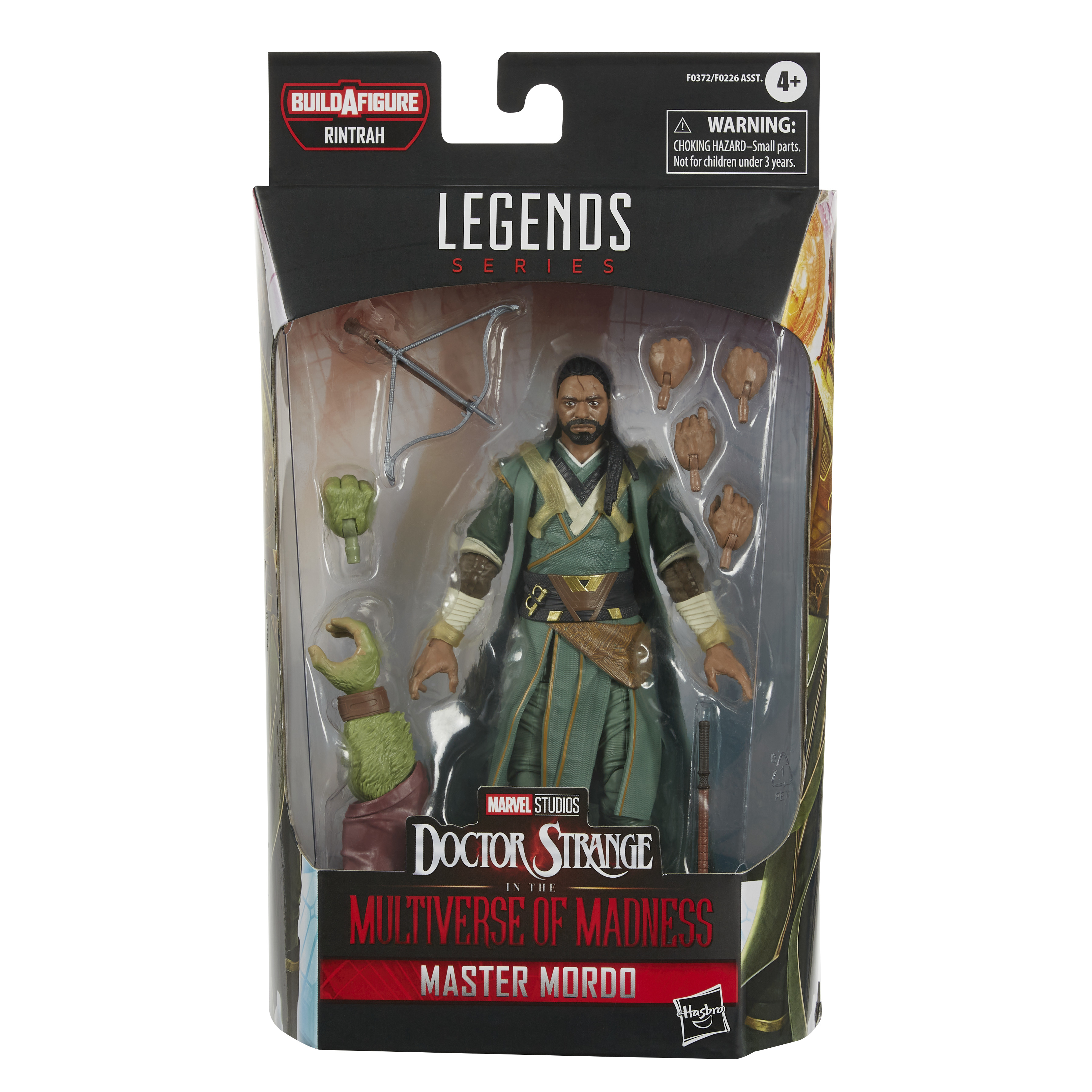 Action figure di Master Mordo in una scatola. Indossa vesti verdi e tiene un'arma.