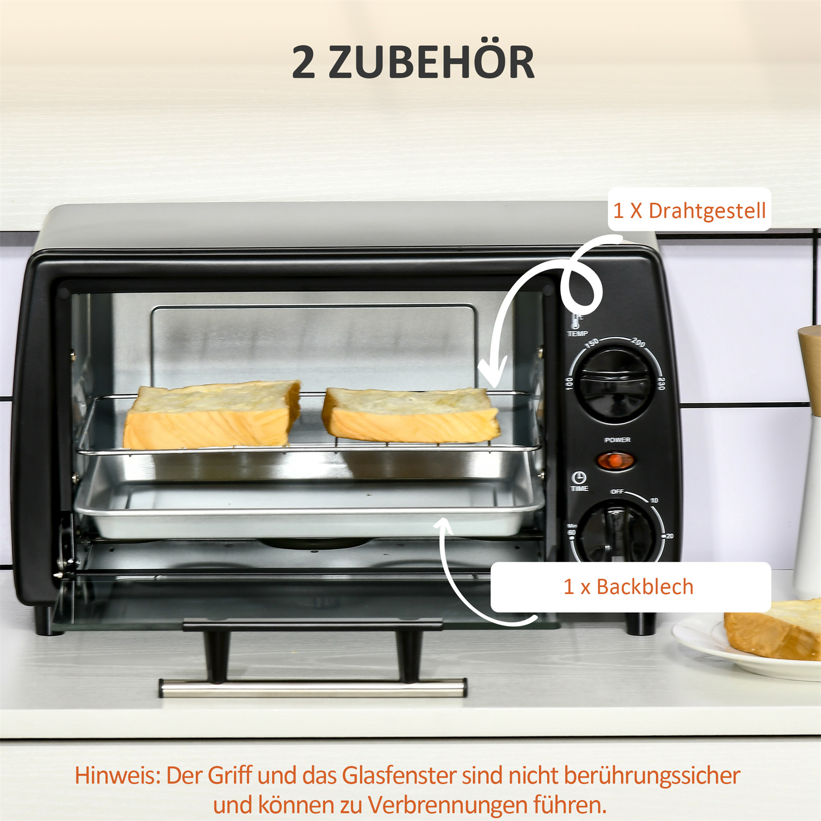 Schwarzer Toasterofen mit Brot darin. Etiketten zeigen die Teile: Rost und Backblech.