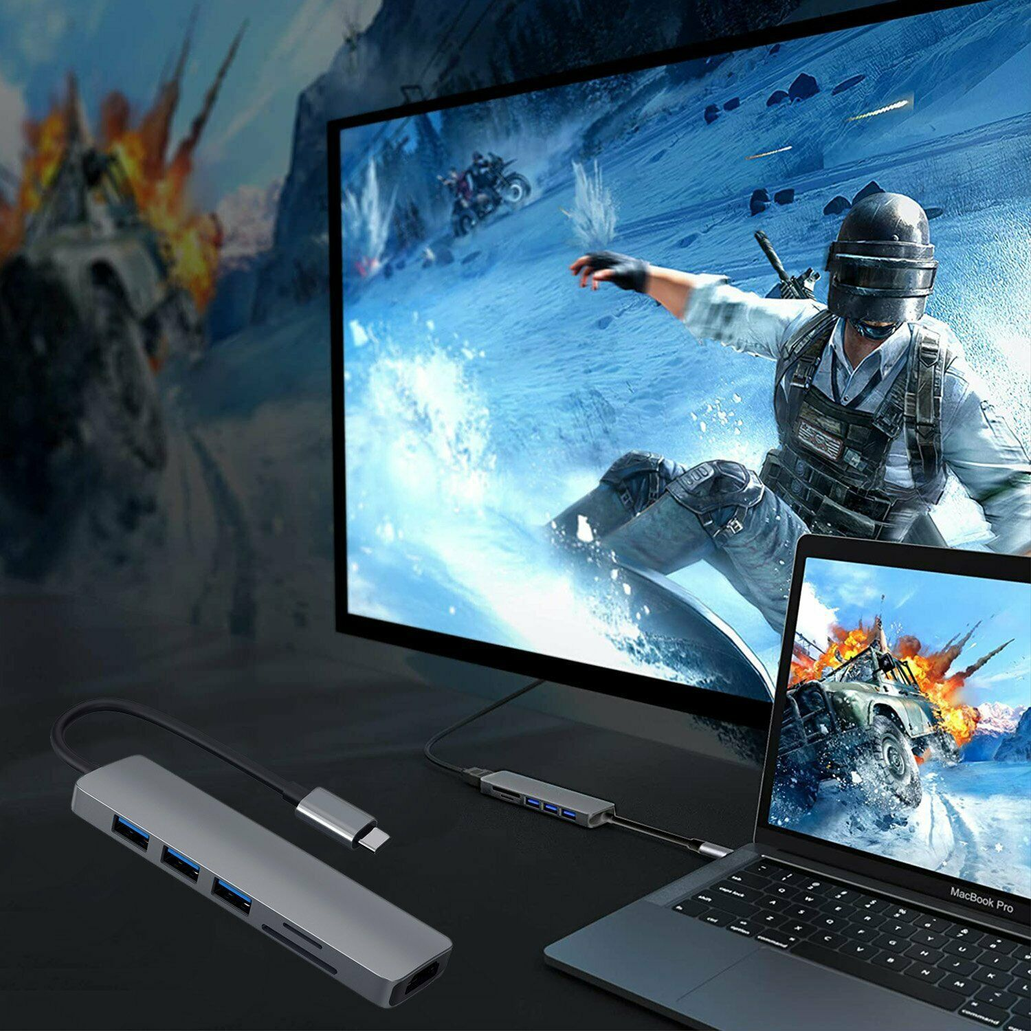 Ein Gaming-Setup: ein Laptop, ein Monitor und ein USB-Hub. Zeigt ein gespieltes Spiel.