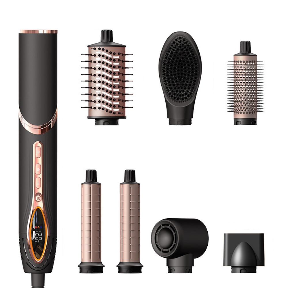 Schwarz-goldener Haarstyler mit verschiedenen Aufsätzen auf weißem Hintergrund.