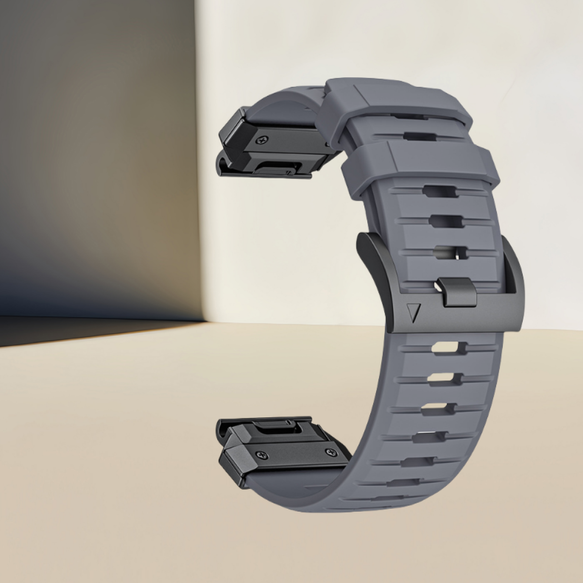 Graues Uhrenarmband mit schwarzen Aufsätzen. Der Hintergrund ist ein heller Farbverlauf.