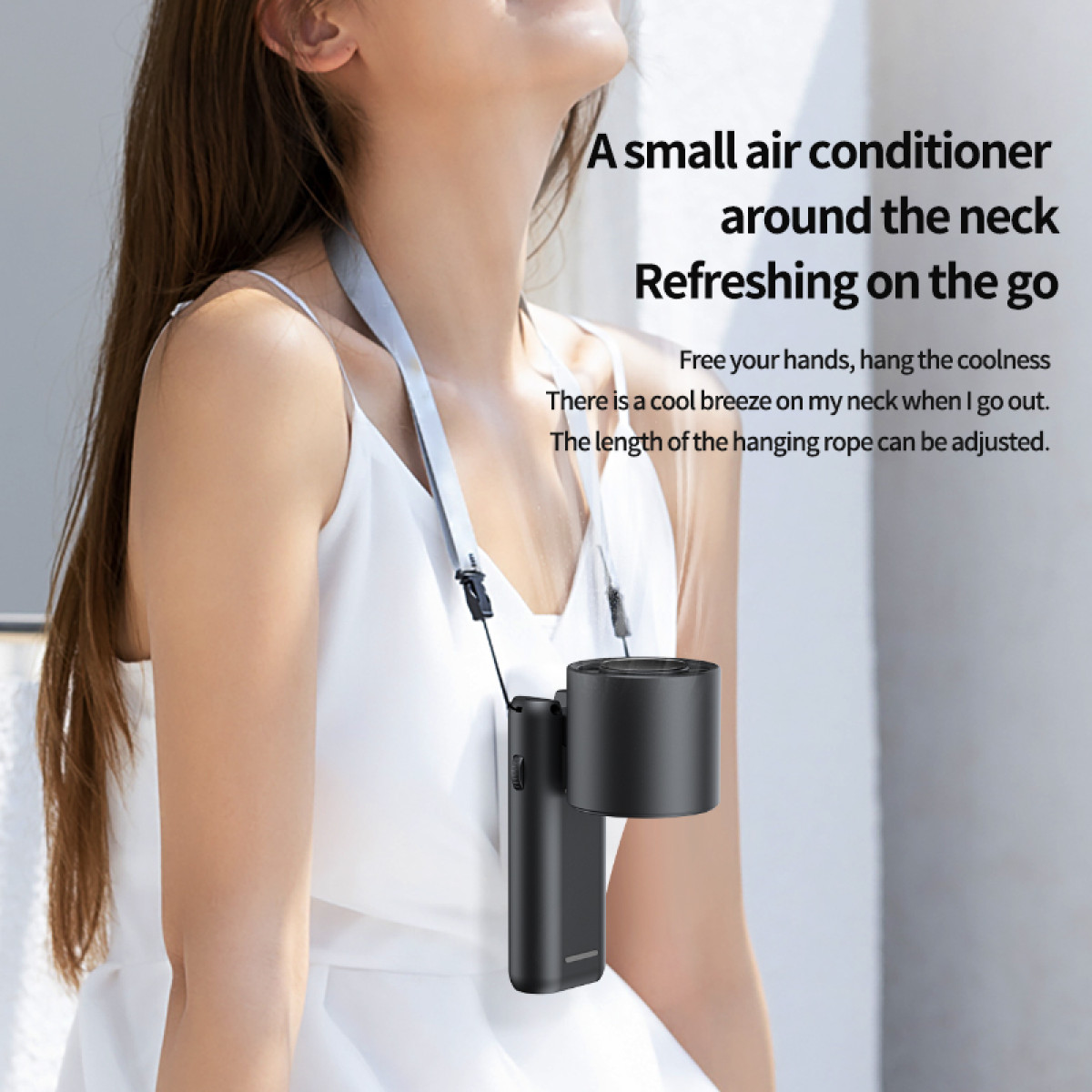 A woman wearing a black neck air conditioner with a hanging cord and text on the top.
