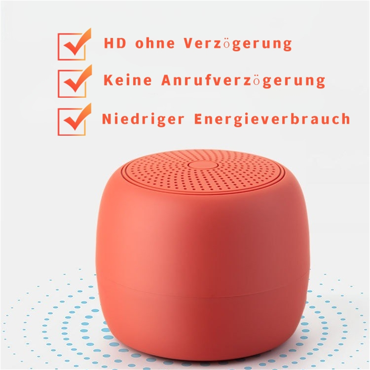 Ein roter, runder, tragbarer Lautsprecher mit Häkchen und Text.
