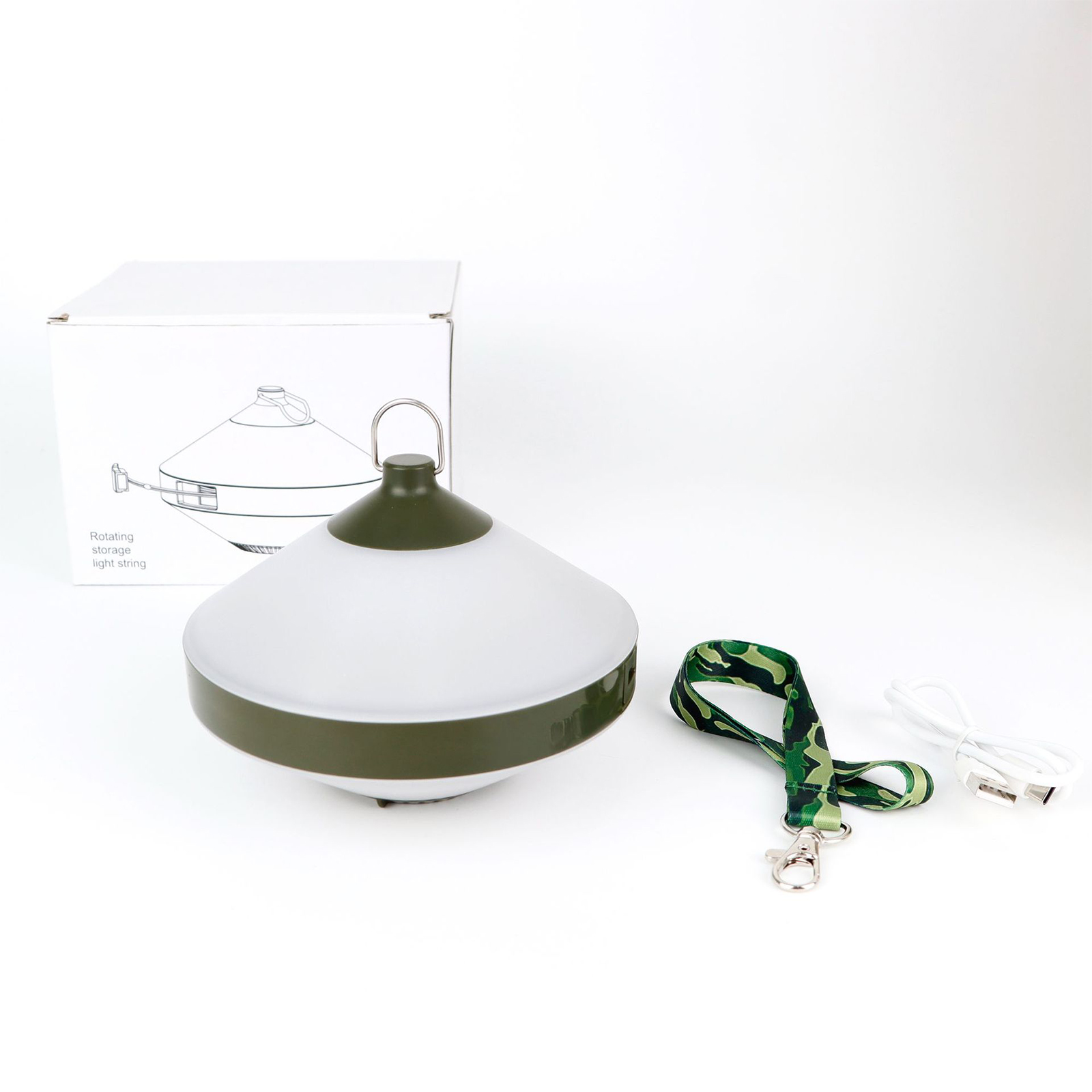 Weiße und olivgrüne Campinglaterne mit Schlüsselband und Ladegerät sowie einer Box.