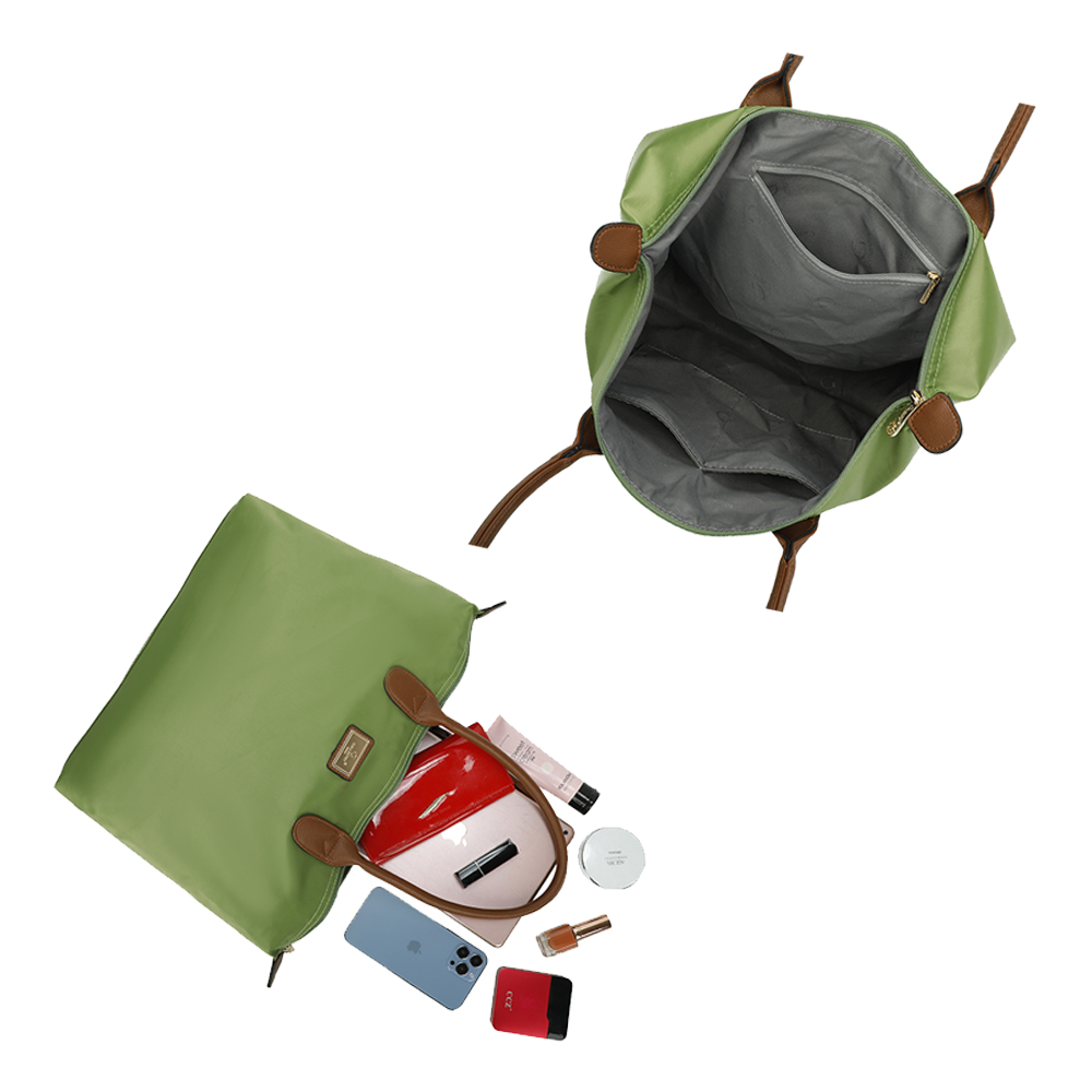 Eine grüne Handtasche, deren Inhalt herausquillt. Enthält ein Telefon, Make-up und anderes Zubehör.
