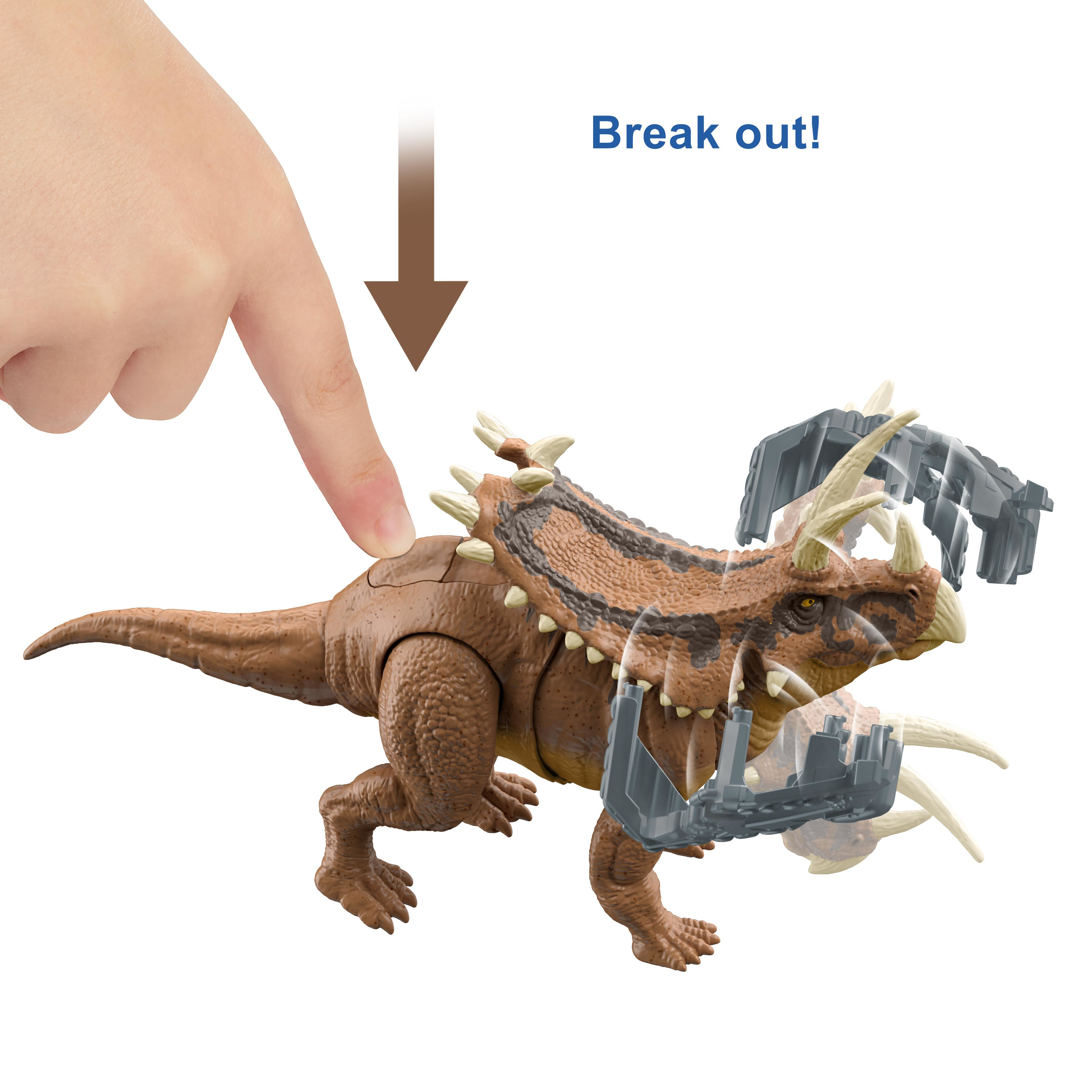Ein Spielzeug-Dinosaurier wird gezeigt, wobei ein Finger nach unten drückt und seine Funktionen aktiviert.