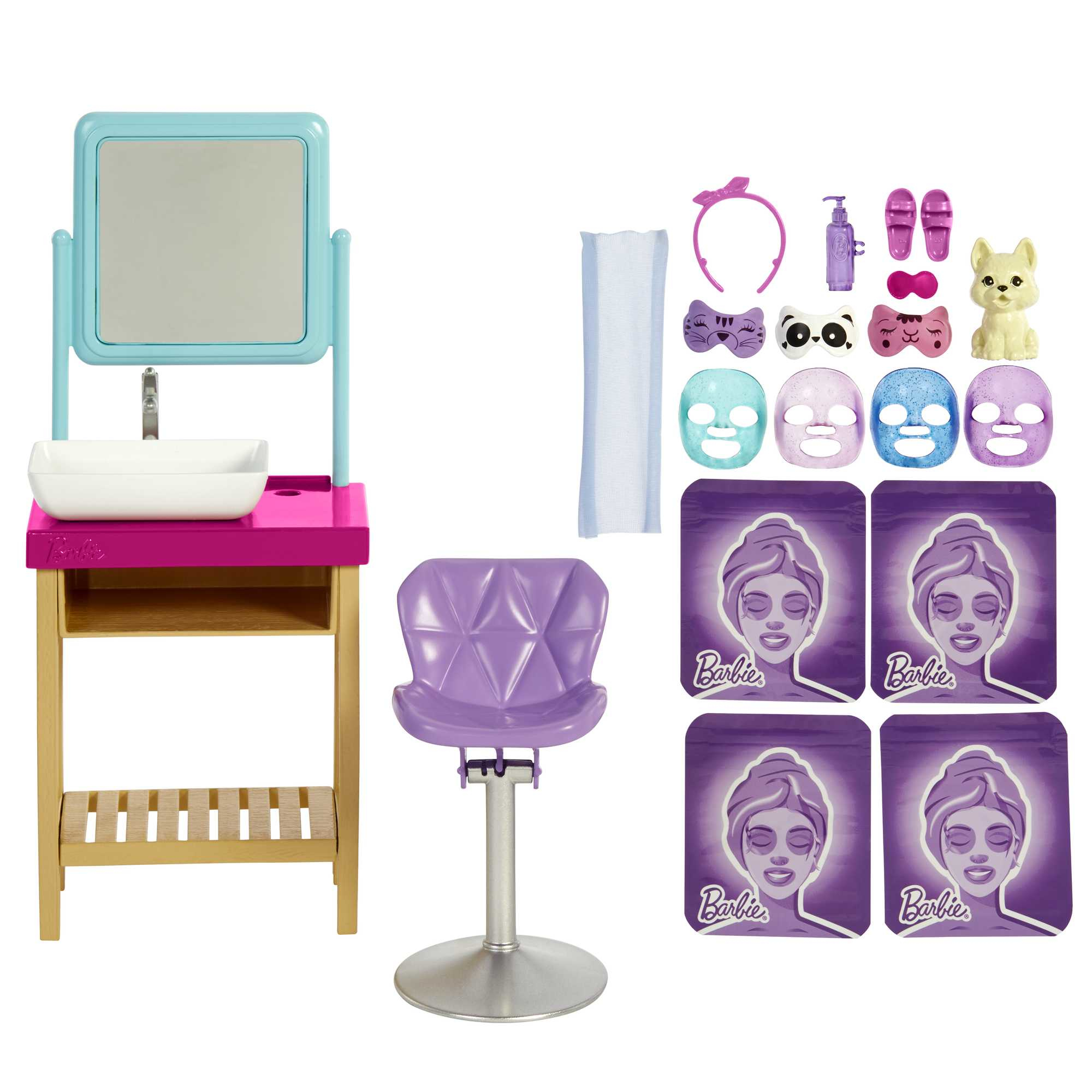 Un set spa giocattolo con lavandino, specchio, sedia, maschere per il viso e accessori, tutto in rosa e blu.