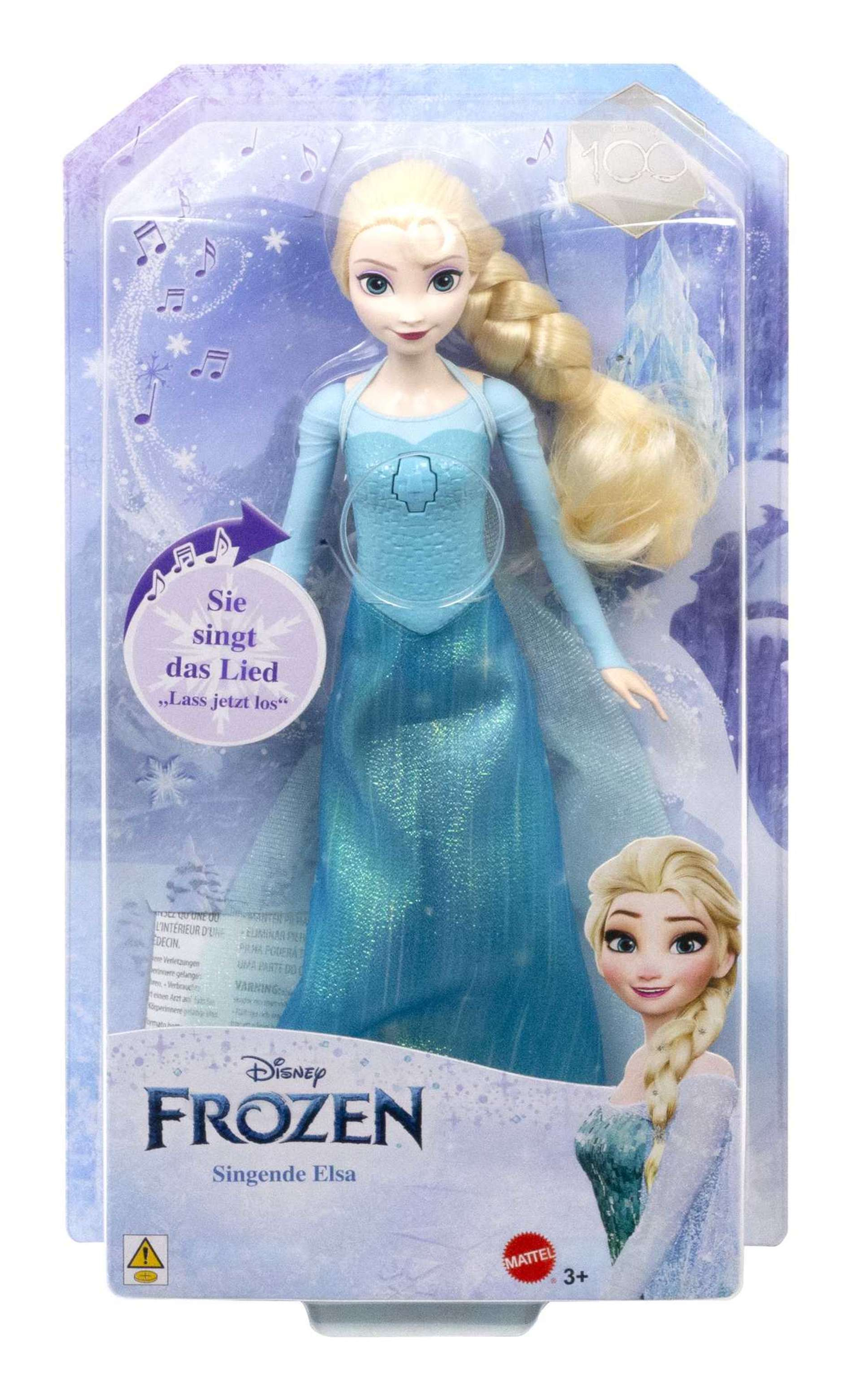 Elsa-Puppe in Verpackung, blondes Haar, blaues Kleid. Frozen-Logo und Text „Singende Elsa“ sichtbar.