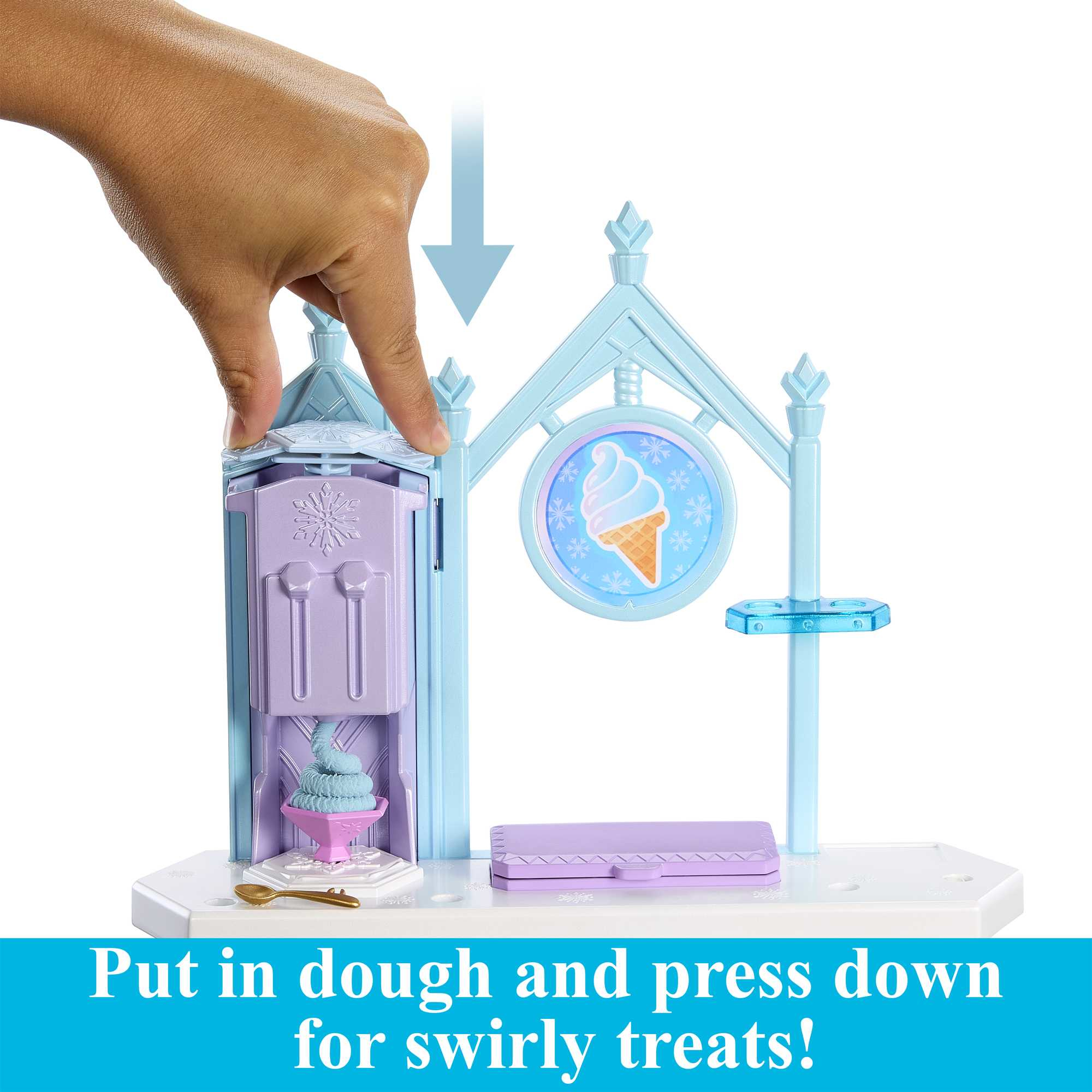 Ręka naciska na zabawkę do robienia lodów. Jest jasnoniebieski i fioletowy ze znakiem lodów.